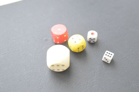 Game dice in the composition of different cubes on background