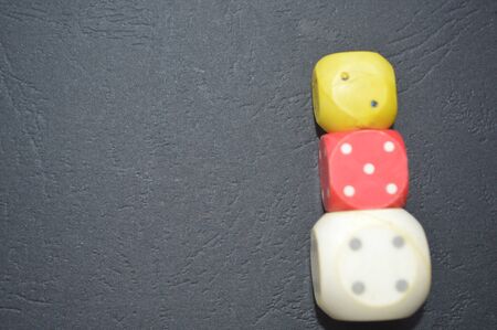 Game dice in the composition of different cubes on backgroundの写真素材