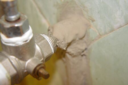 Insulation of the cold water supply pipe of the apartment with a liquid heaterの写真素材