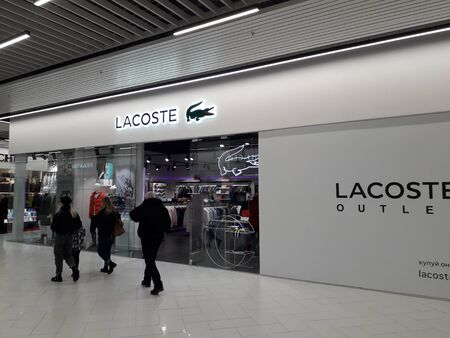KIEV, UKRAINE - DECEMBER 28, 2019: Lacoste logo in facades of boutiques in a supermarketのeditorial素材