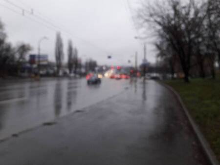 KIEV, UKRAINE - DECEMBER 28, 2019: Winter street with cars on the road after rainのeditorial素材