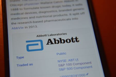 KIEV, UKRAINE - DECEMBER 30, 2019: Logos of multinational companies on the smartphone screen according to version the S&P 100のeditorial素材