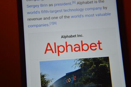 KIEV, UKRAINE - DECEMBER 30, 2019: Logos of multinational companies on the smartphone screen according to version the S&P 100のeditorial素材