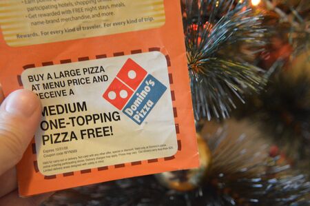 KIEV, UKRAINE - DECEMBER 31, 2019: Logos of brands and trademarks on the background of the Christmas treeのeditorial素材