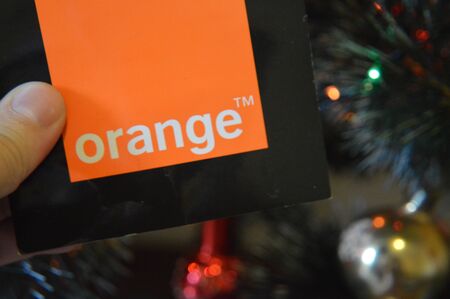 KIEV, UKRAINE - DECEMBER 31, 2019: Logos of brands and trademarks on the background of the Christmas treeのeditorial素材
