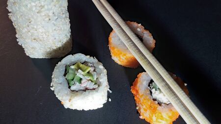 Different sushi sets from a japanese restaurant on  backgroundの写真素材