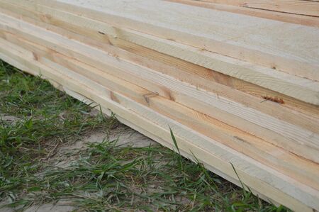 Lumber boards and pine bars for the construction