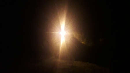 Bright flash of light on black the background