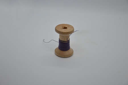 Threads and spools for sewing clothes on a white the background