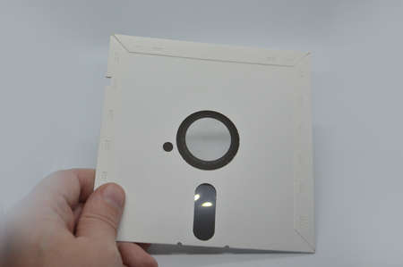 Retro media discs and floppy disks on a the white background