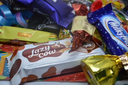 KIEV, UKRAINE - DECEMBER 17, 2020: Candy from an unpacked present for new year and the christmasのeditorial素材