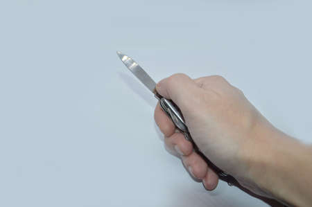 Various items in a male hand on a the white backgroundの写真素材