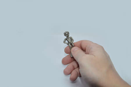 Various items in a male hand on a the white backgroundの写真素材