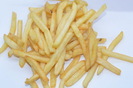 Fried fries in strips on a the white plate