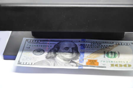US dollars are checked for a authenticity