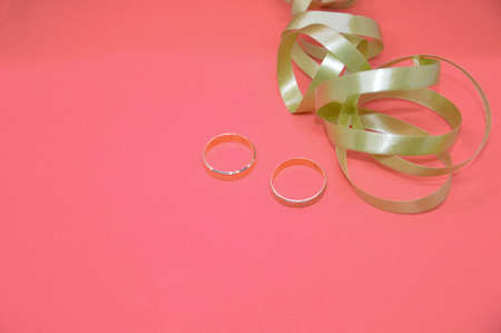 Wedding and engagement rings on the background of a the family holiday theme