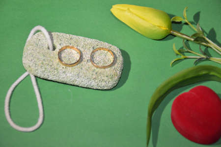 Wedding and engagement rings on the background of a the family holiday themeの写真素材