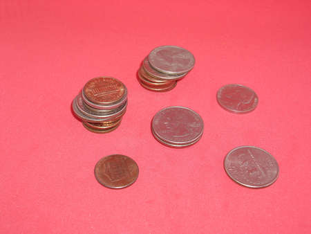 Metal coins money USA on a red background