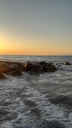 Sunset on the shore of the Agean Sea in Rhodes in the Greece