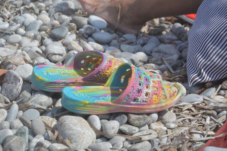 Coral slippers for swimming in a the Aegean Seaの写真素材