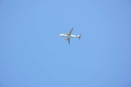 Takeoff of a passenger plane against in the blue sky