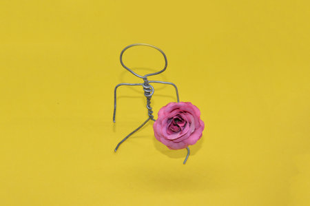 Human figure made of metal wire with an the objectの写真素材