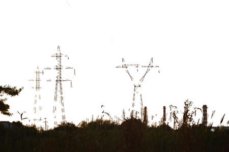 Poles and wires of high-voltage power the lines