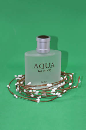 Perfume and toilet water on a green background with the itemsのeditorial素材