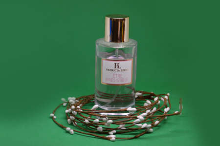 Perfume and toilet water on a green background with the itemsのeditorial素材