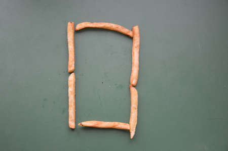 Letters of the english alphabet laid out from french the fries