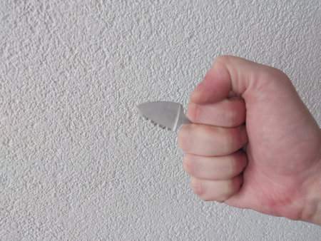 Poke knife for self-defense in the hand of a manの写真素材