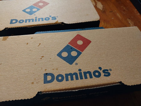 KYIV, UKRAINE - October 4, 2023: Roll with beef, cheese and bacon the Domino's Pizzaのeditorial素材