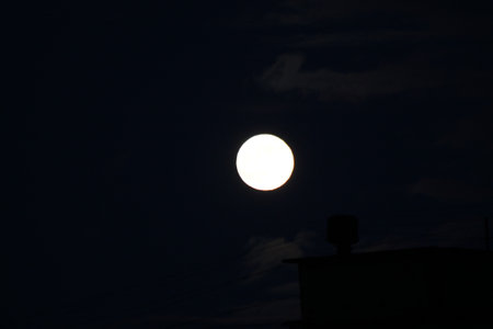 Moon over the night cityの写真素材
