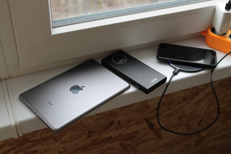 KYIV, UKRAINE - February 21, 2024: Charging an Apple smartphone, wired or the wireless