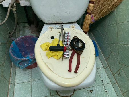 Repair of an old toilet with a direct flushの写真素材