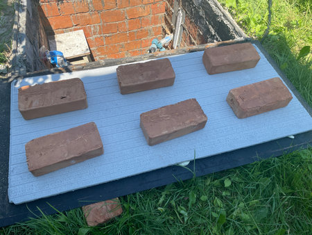 A well pit being insulated to protect plumbing and water access from freezing during winter.の写真素材