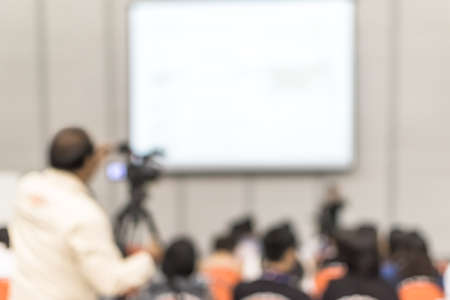 Seminar training blur background workshop event video recording camera man and speaker lecturer...