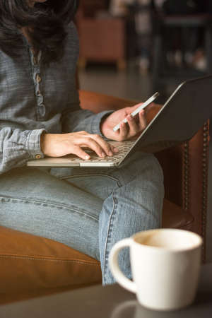Digital lifestyle blog writer or business person using smart device working on internet communication technologyの写真素材