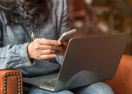 Digital lifestyle blog writer or business person using smart device working on internet communication technologyの写真素材