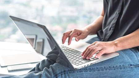 Digital lifestyle blog writer or business person using smart device working on internet...