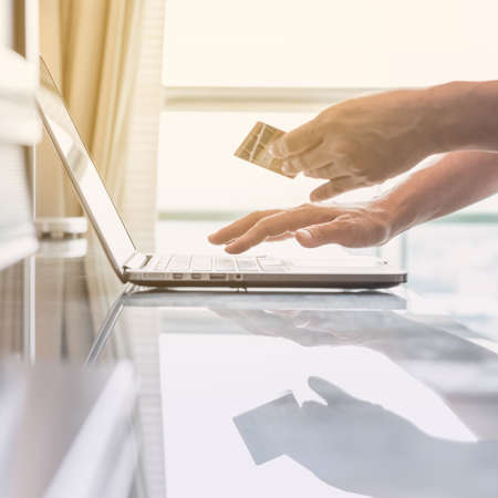 Consumer buyer using credit card paying shopping online bill payment via internet banking...