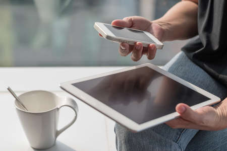 Digital lifestyle blog writer or business person using smart device ...