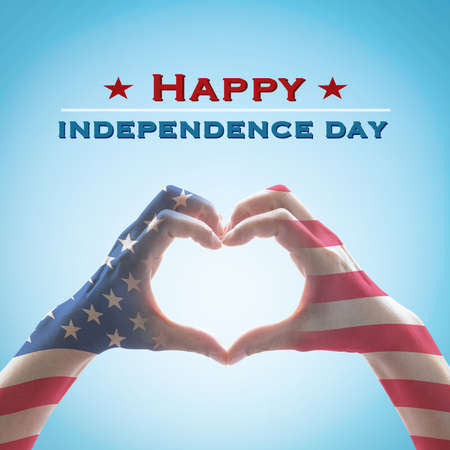 Happy independence day 4th of July  with National America flag pattern on people hands in heart shapeの写真素材