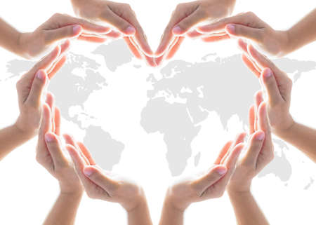 International cooperative, charity aid, friendship and world protection concept with heart collaborative handsの写真素材