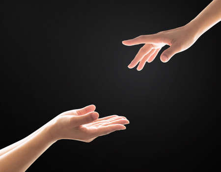 Charity donation concept with women's hand  in giving and receiving  gestureの写真素材