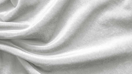 Slver white velvet background or velour flannel texture made of cotton or wool with soft fluffy velvety satin fabric cloth metallic color materialの写真素材
