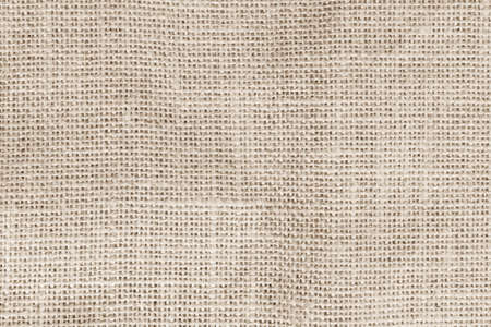 Jute hessian sackcloth woven burlap texture background in sepia cream brown colorの写真素材