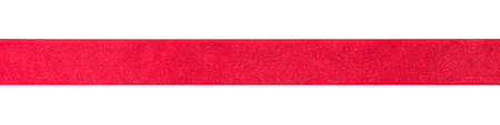 Red ribbon band stripe or satin fabric bow isolated on white background with clipping path for banner design, greeting card and Christmas gift decorationの写真素材