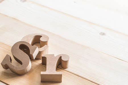 CSR (Corporate social responsibility) abbreviation wood letters on natural white wooden background...