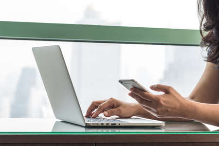 Digital lifestyle blog writer or business person using smart device working on internet communication technologyの写真素材